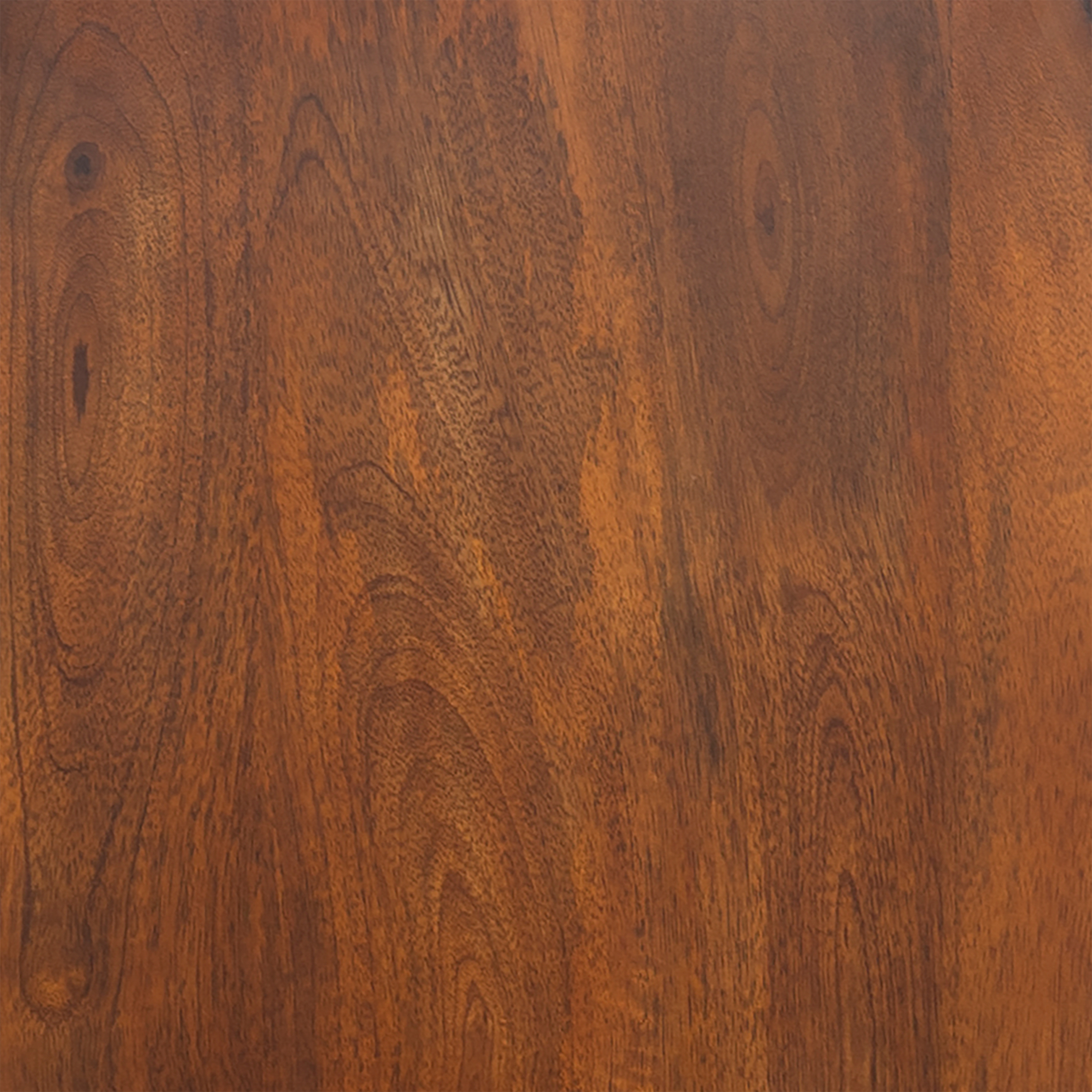 Texture close-up of brown wood grain on sideboard door
